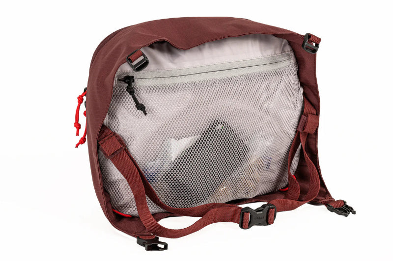 Red backpack with a clear front pocket on a white background