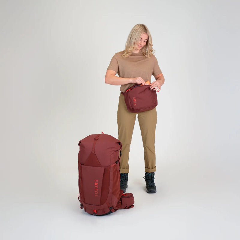 Woman with red travel bags on a white background