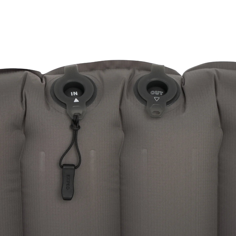 Inflatable camping mattress with valve controls on a white background