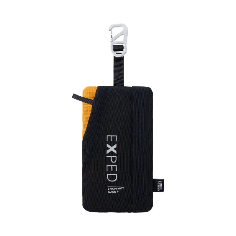 Black travel case with yellow interior and Exped branding on a white background