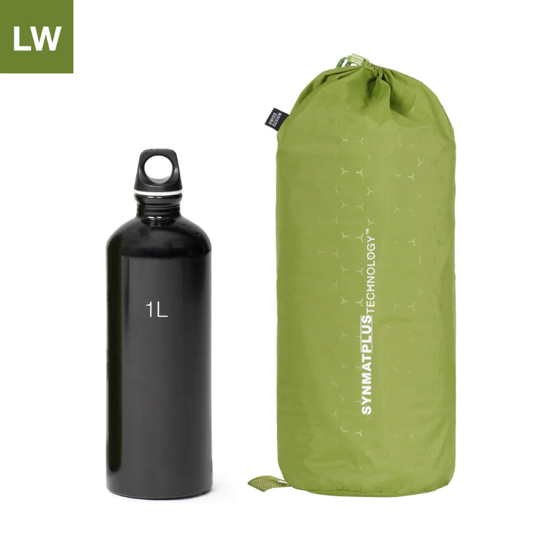 Black water bottle with a 1L label next to a green compression sack on a white background