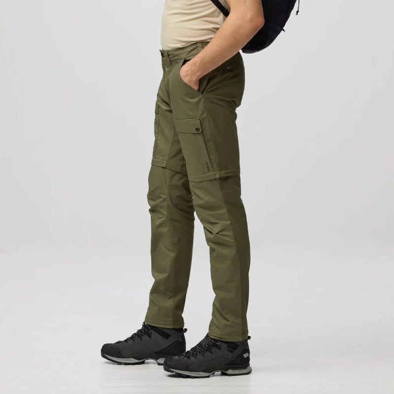 Person wearing green cargo pants on a white background