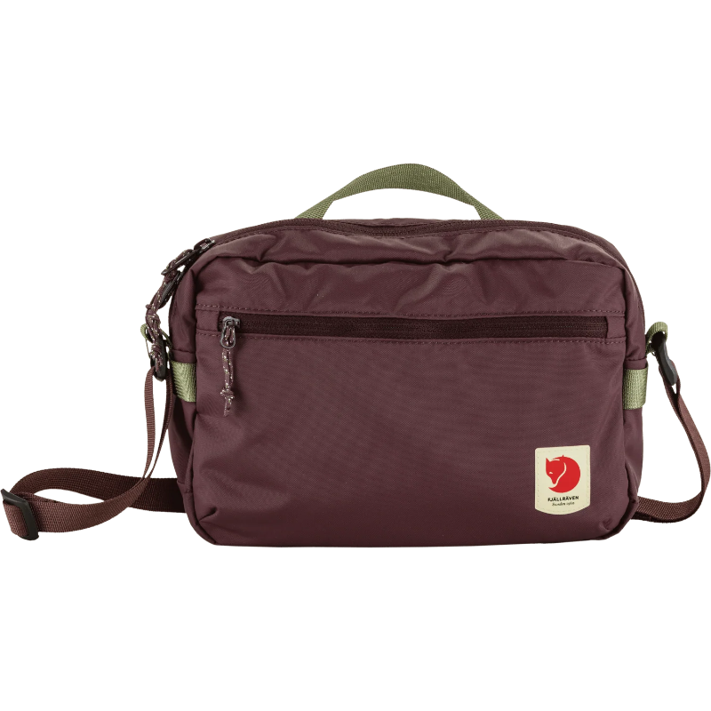 Brown shoulder bag with a visible brand logo on a white background