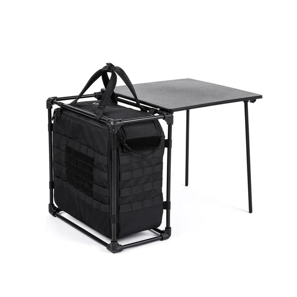 Black folding table with a black bag on a white background
