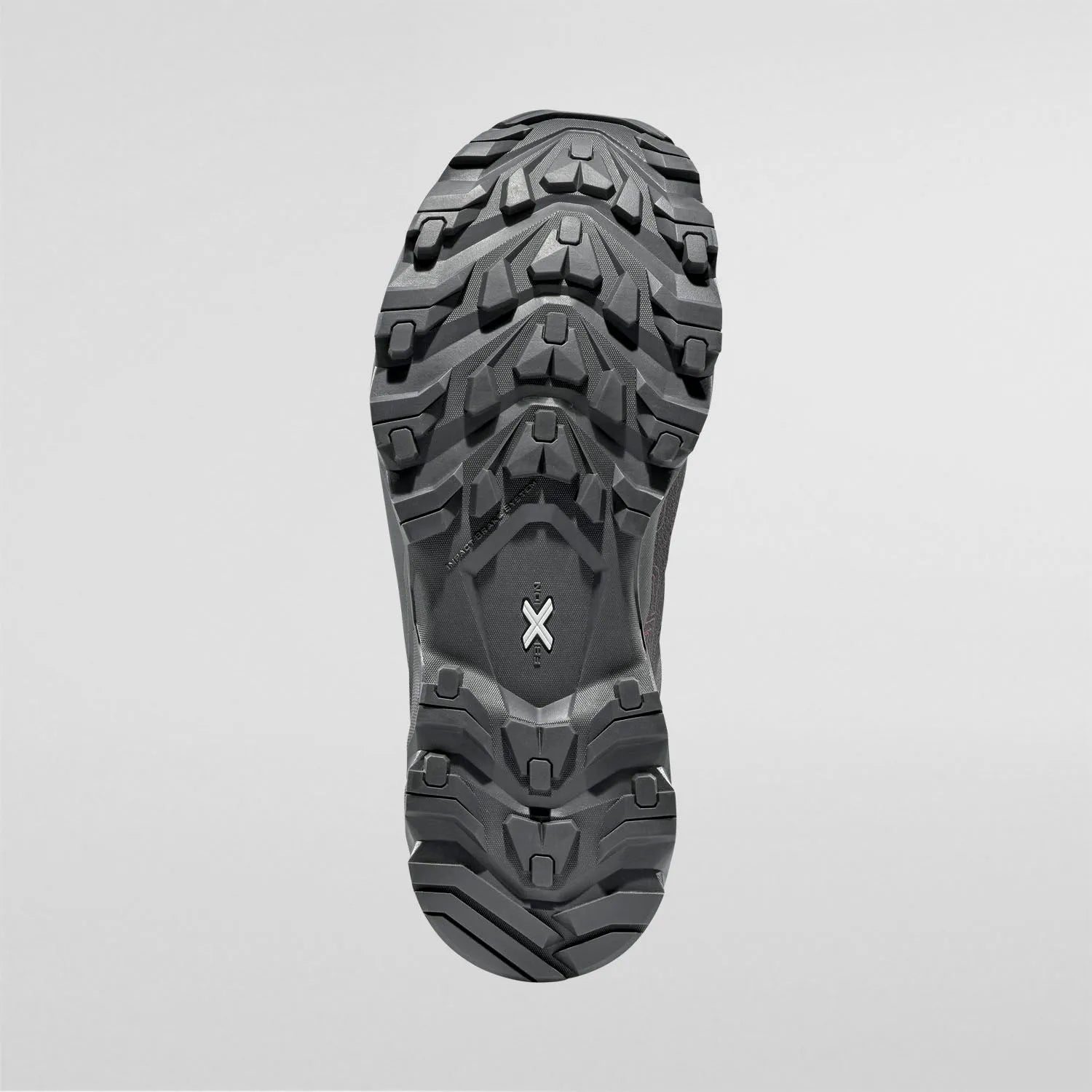 Close-up of a black womens waterproof hiking boot sole on a light gray background