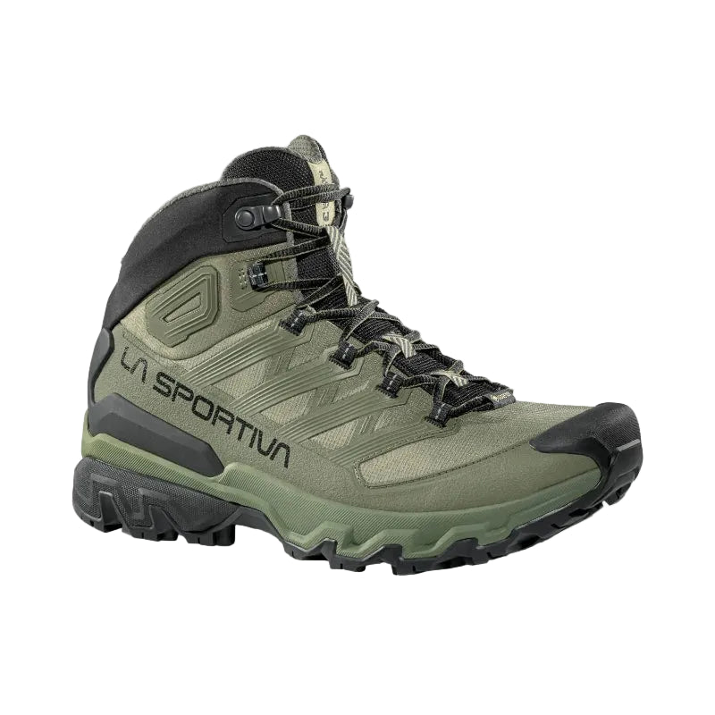 Green hiking boot with black accents on a light gray background
