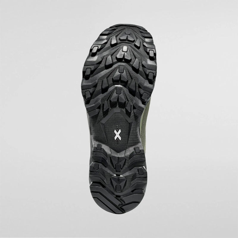 Close-up of a hiking shoe sole with tread pattern on a light gray background