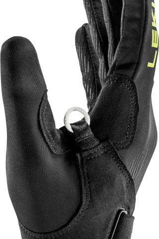 Close-up of a black glove with a white ring on a white background