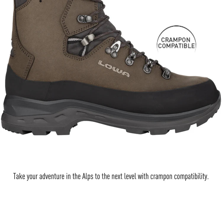 Brown hiking boot with black sole on a white background, featuring Crampon compatibility label.
