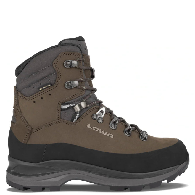 Brown hiking boot with black sole on a white background