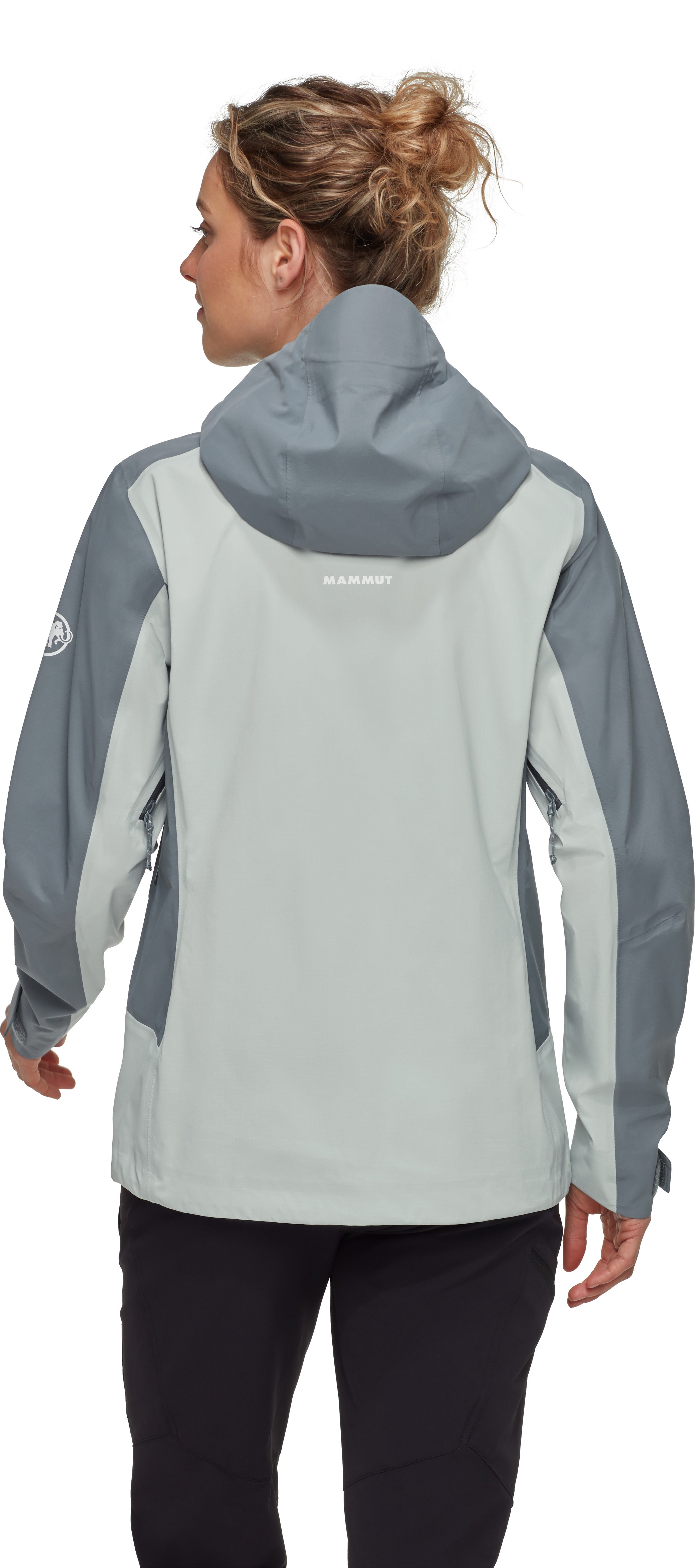 Woman wearing a gray and blue jacket with Columbia logo on a white background