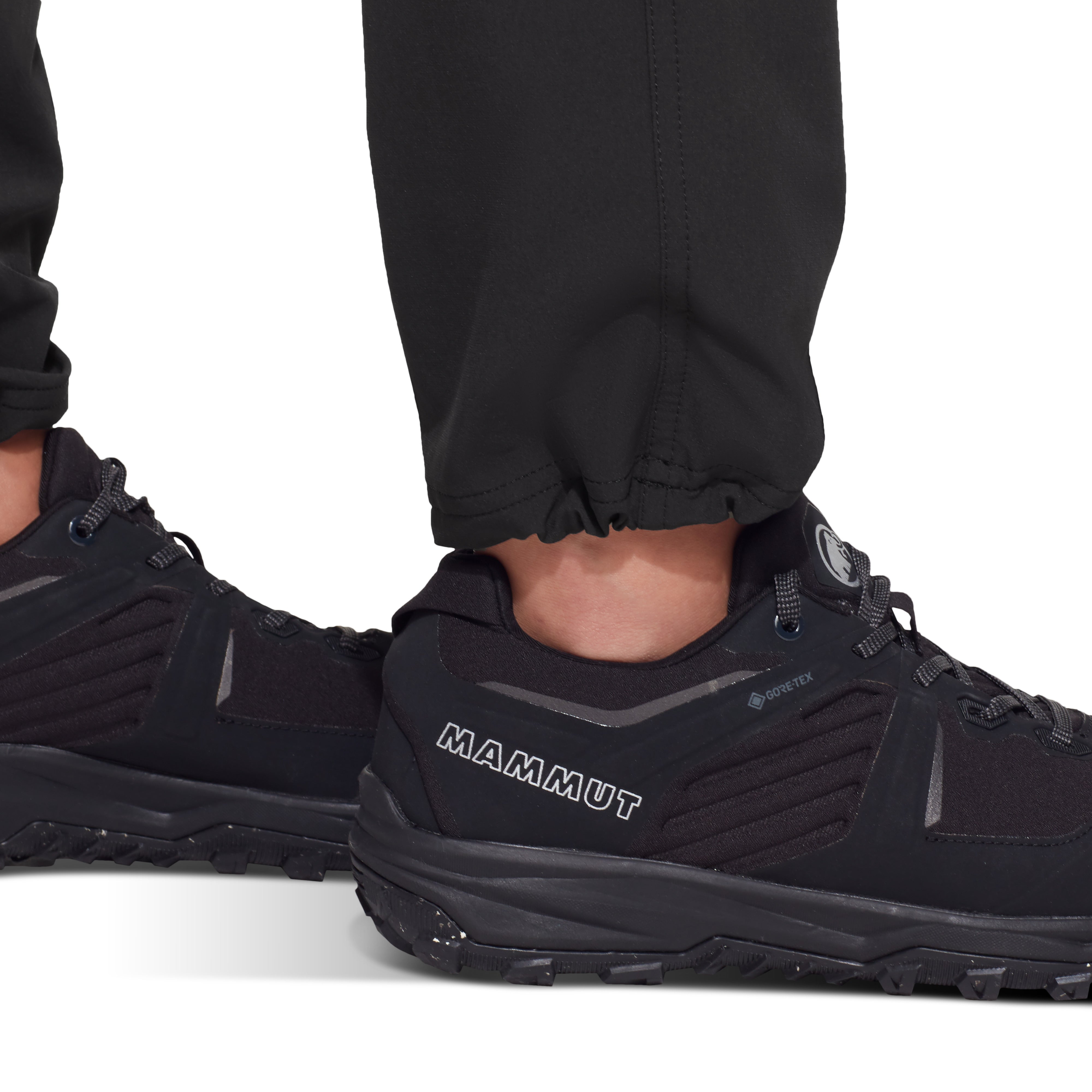 Black hiking shoes with 'Mammut' branding on a white background