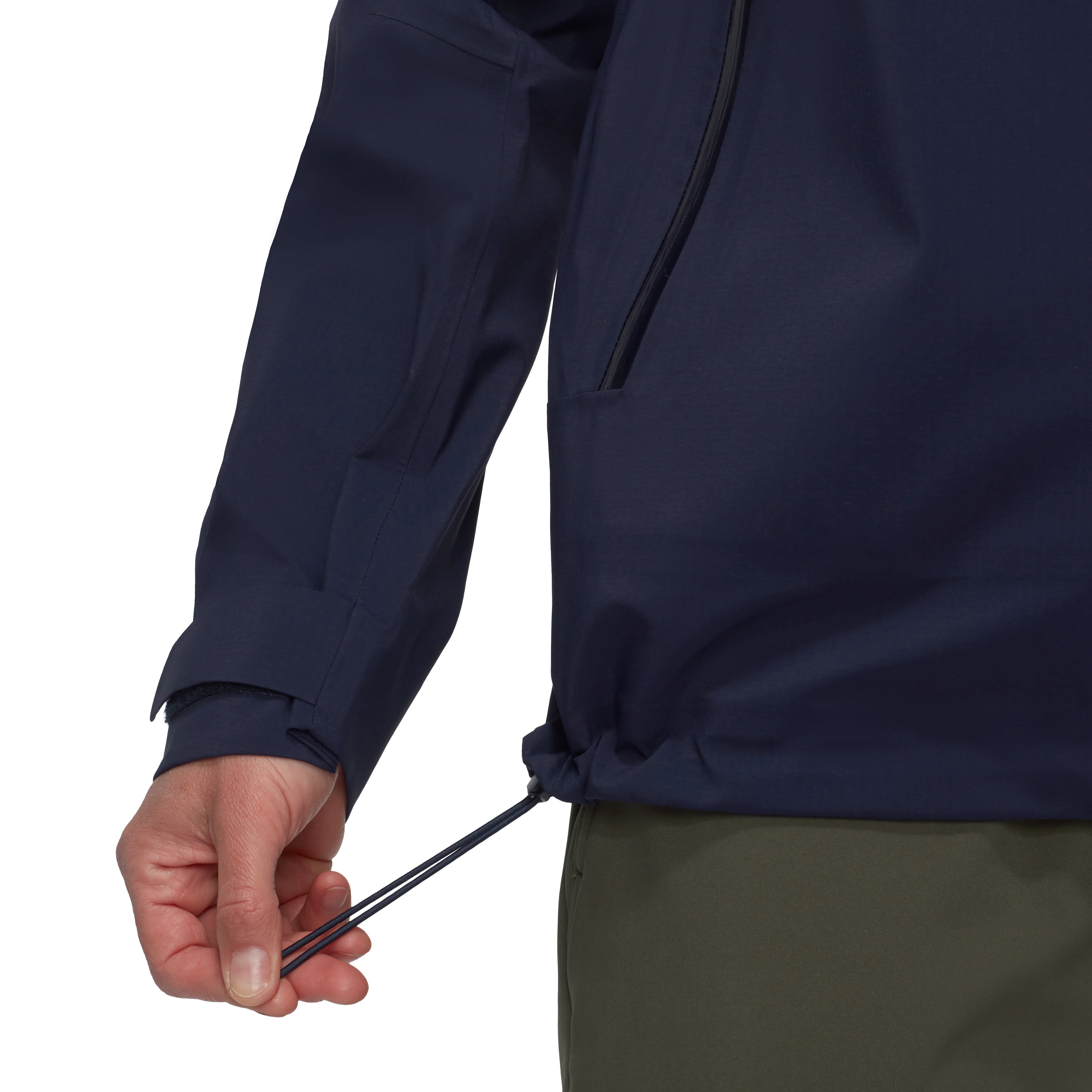 Navy blue jacket with a hand adjusting the drawstring on a white background