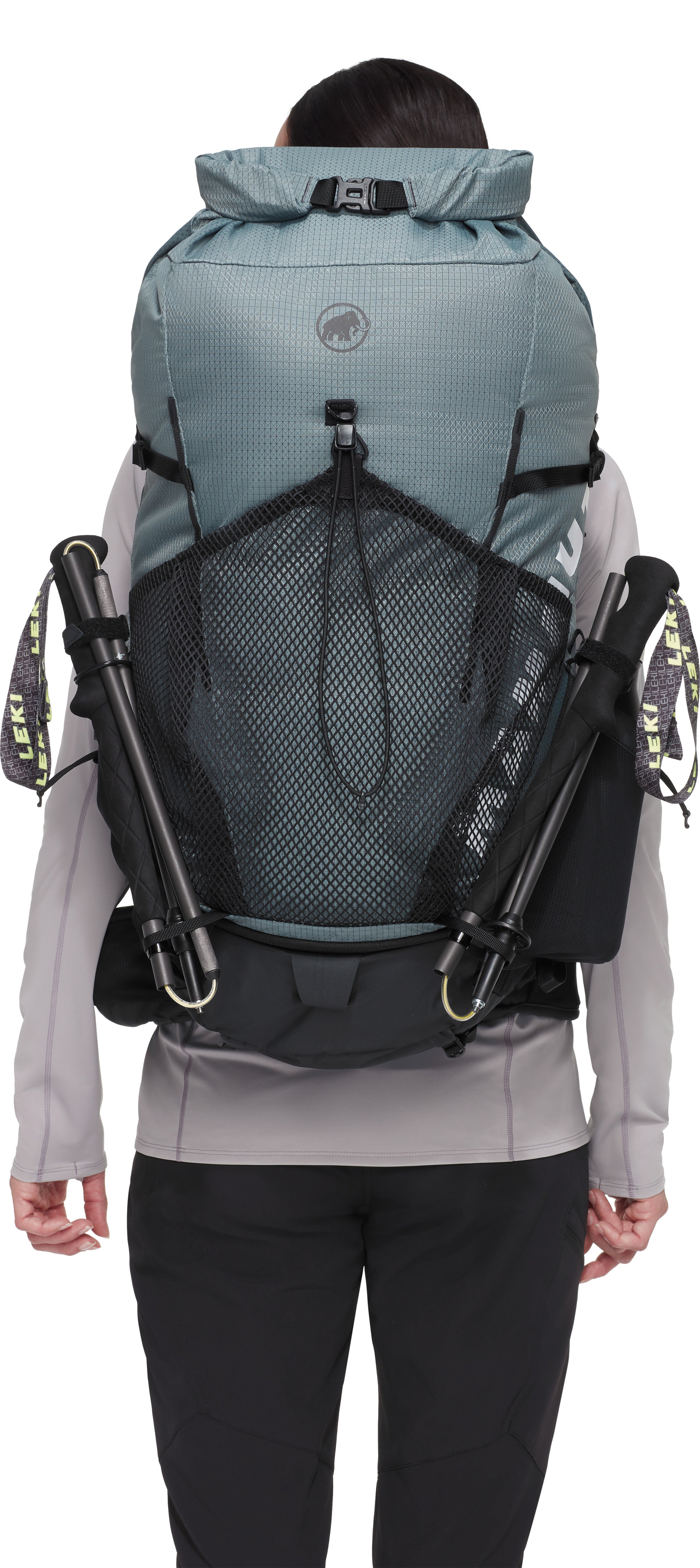 Person wearing a large blue backpack with visible brand logo on a white background