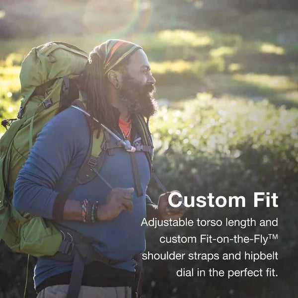 Man with a backpack in a natural setting with text about customizable fit.