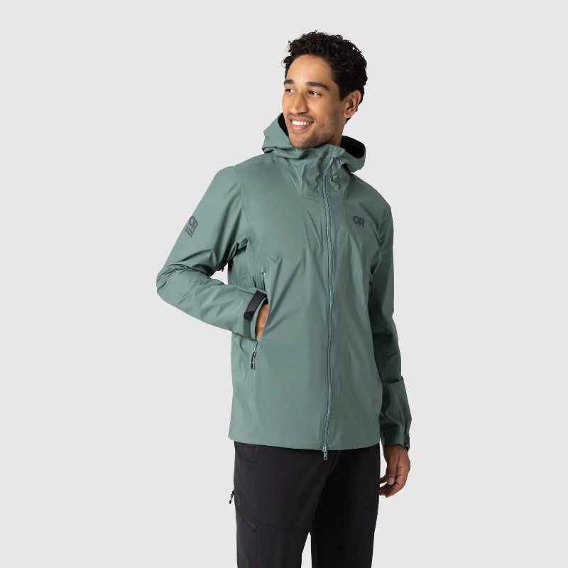 Person wearing a green jacket on a white background