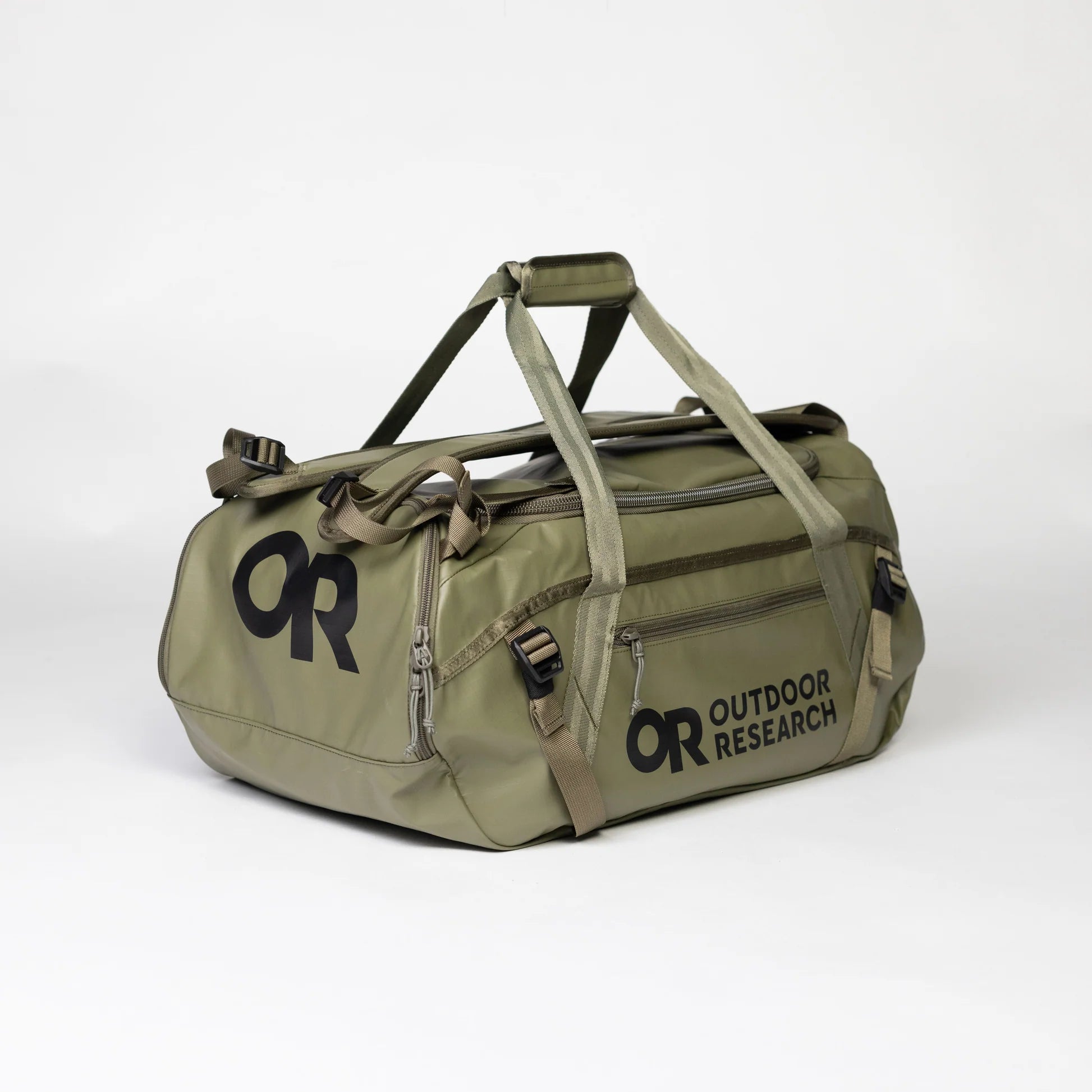 Green duffel bag with 'Outdoor Research' logo on a white background