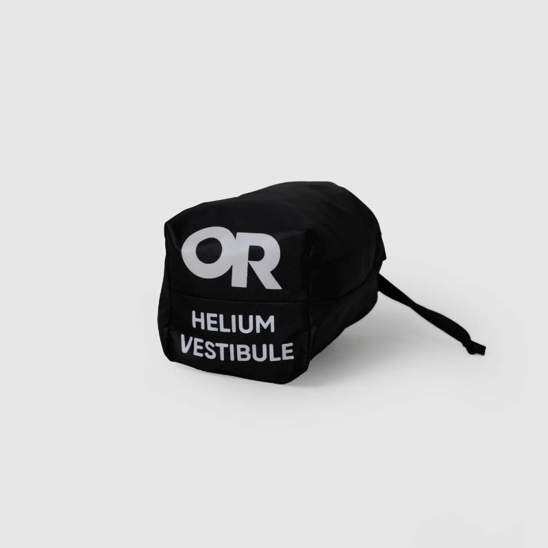Black Helium Vestibule bag with 'OR' logo on a light gray background