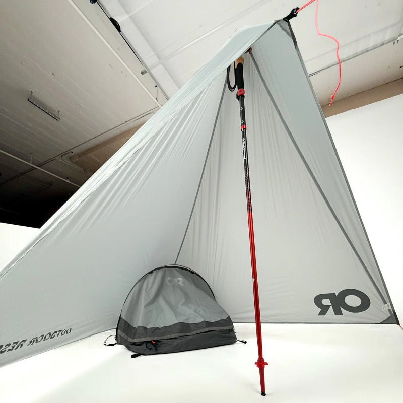 Lightweight vestibule attached to OR UL Helium Bivy with a red pole on a white background