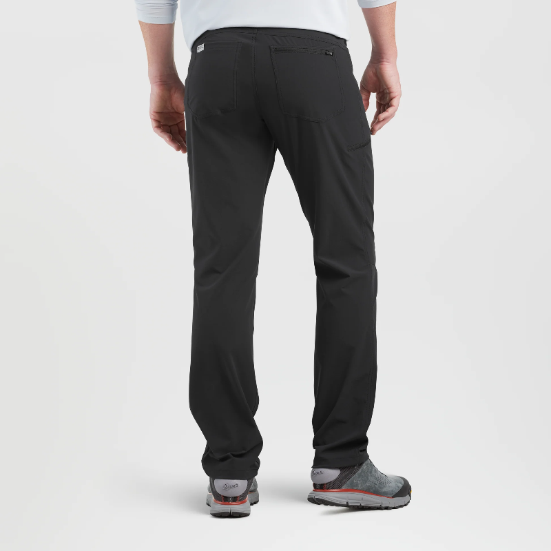 Person wearing black pants on a white background
