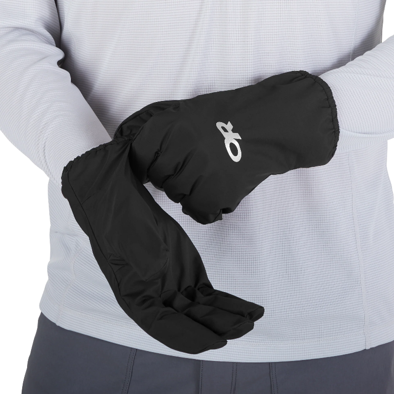 Black gloves with a brand logo worn by a person in a light gray jacket.