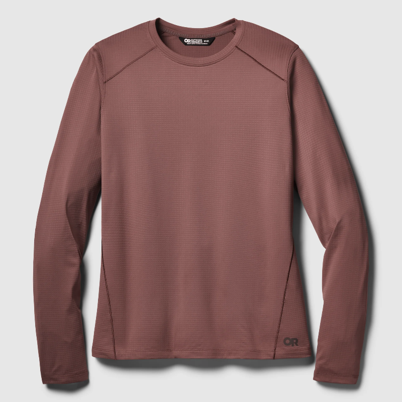 A long-sleeve athletic shirt in a dusty rose or mauve color, featuring a textured waffle knit fabric, raglan sleeves, and a small black 'OR' logo near the bottom hem, displayed on a light gray background.