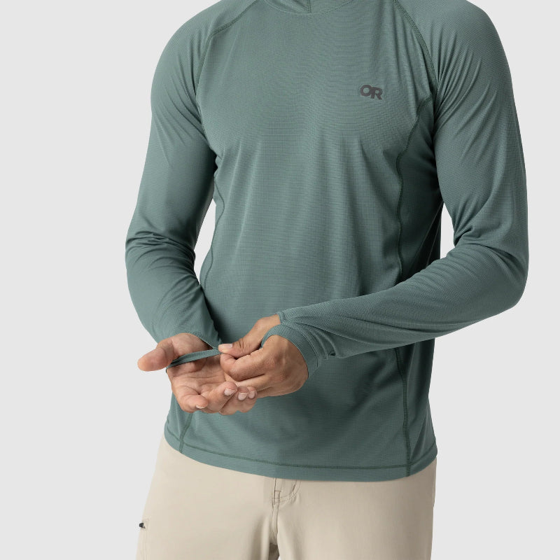 Person wearing a green sun hoodie shirt with a brand logo on a white background