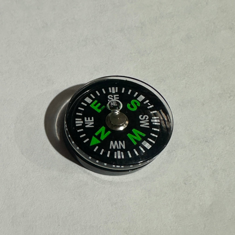Small Button compass on a white background