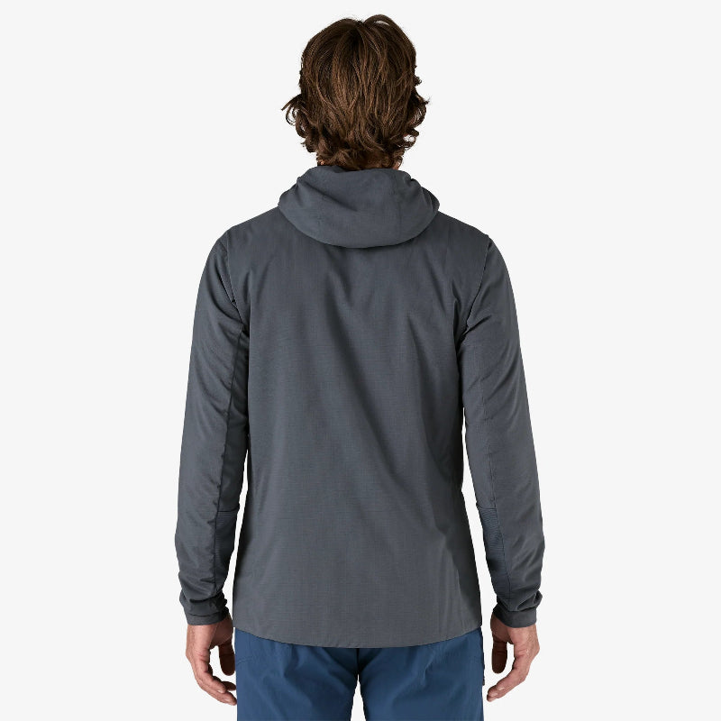 Person wearing a gray jacket on a white background