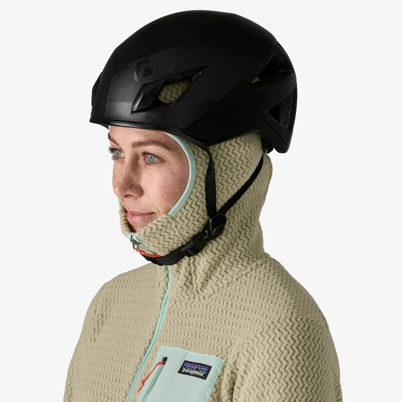 Woman wearing the Patagonia Women's R1 Air Fleece Full-Zip Hoody Smolder Blue with a helmet