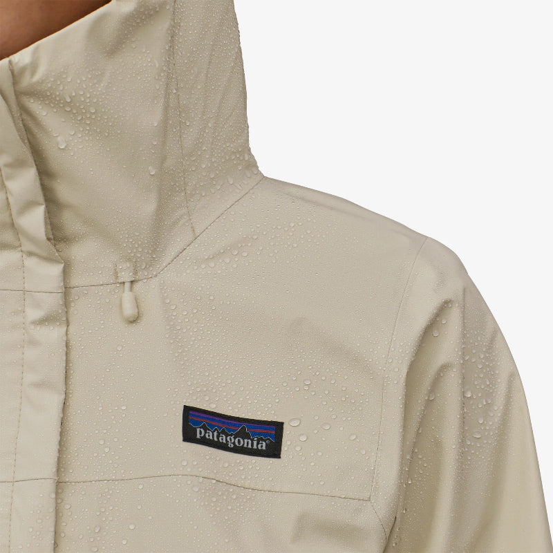 A wet Patagonia Women's Torrentshell 3L Rain Jacket