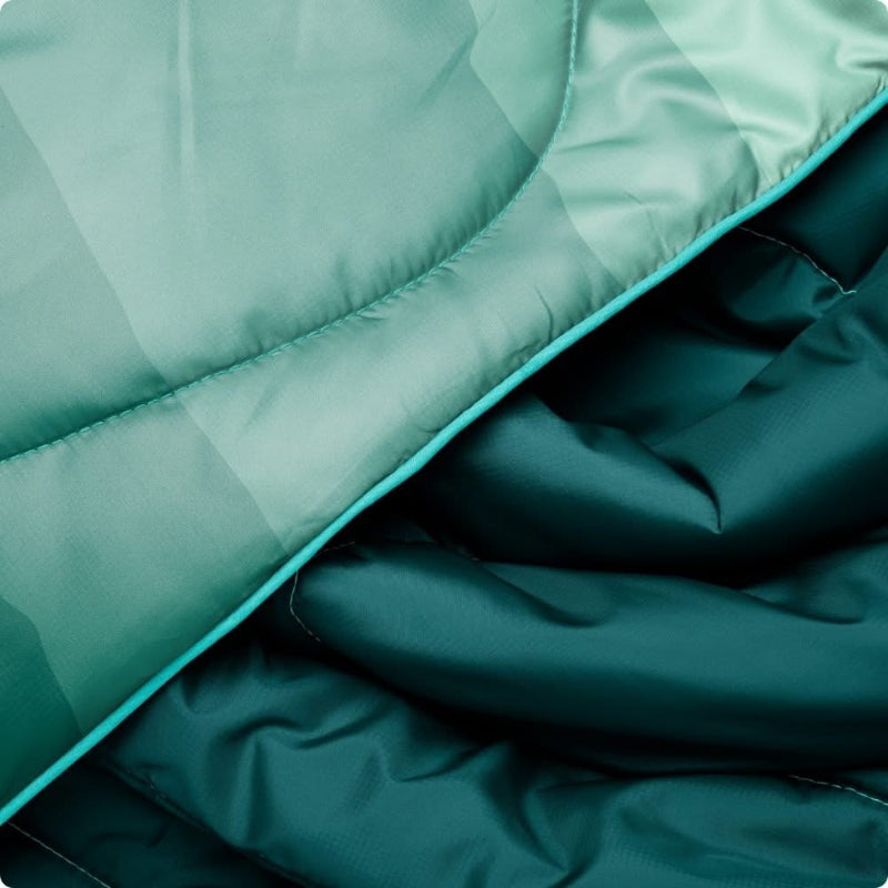 Close-up of teal quilted fabric with a soft texture