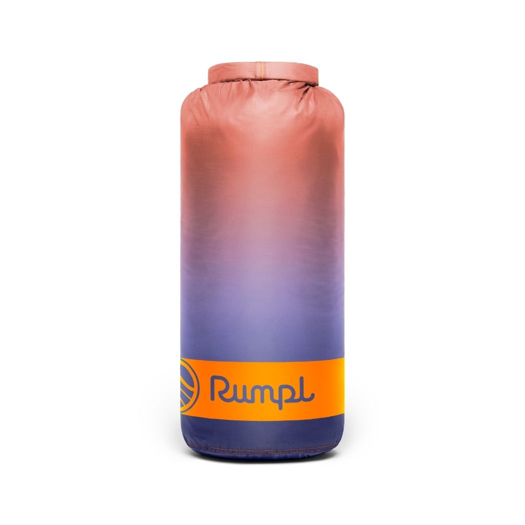 Gradient pink to blue bag with 'Rumpl' logo on a white background