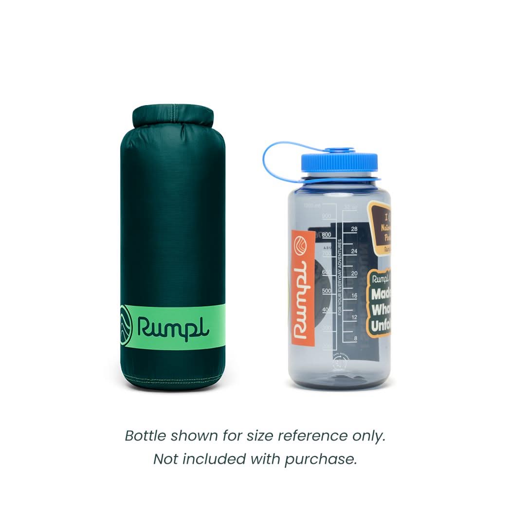 Rumpl travel blanker shown next to a Nalgene bottle