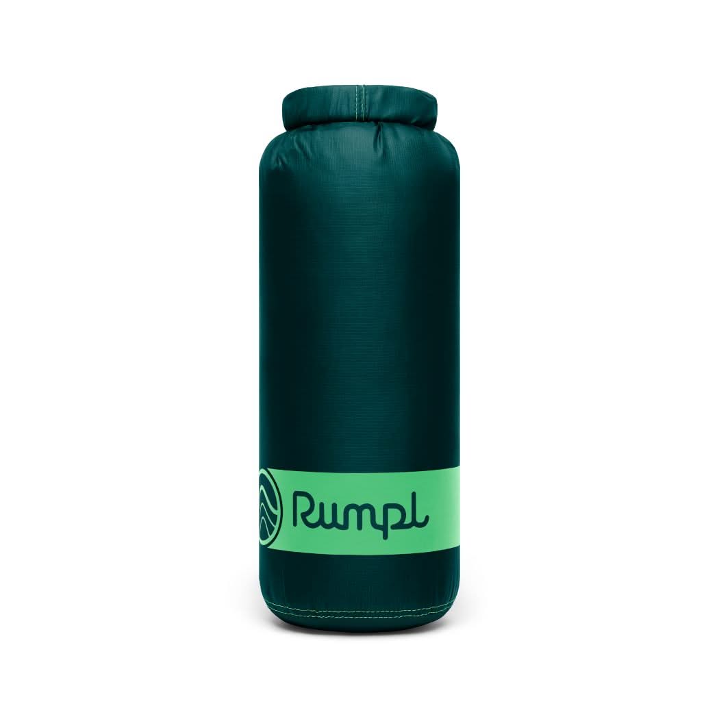 Rumpl travel blanket in green color on white background