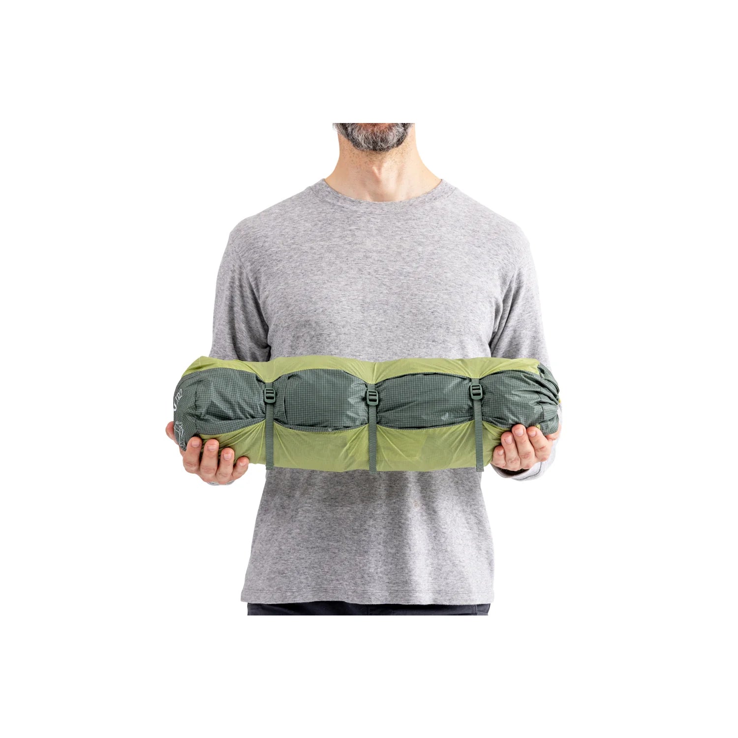 Person holding a green and gray waist bag on a white background