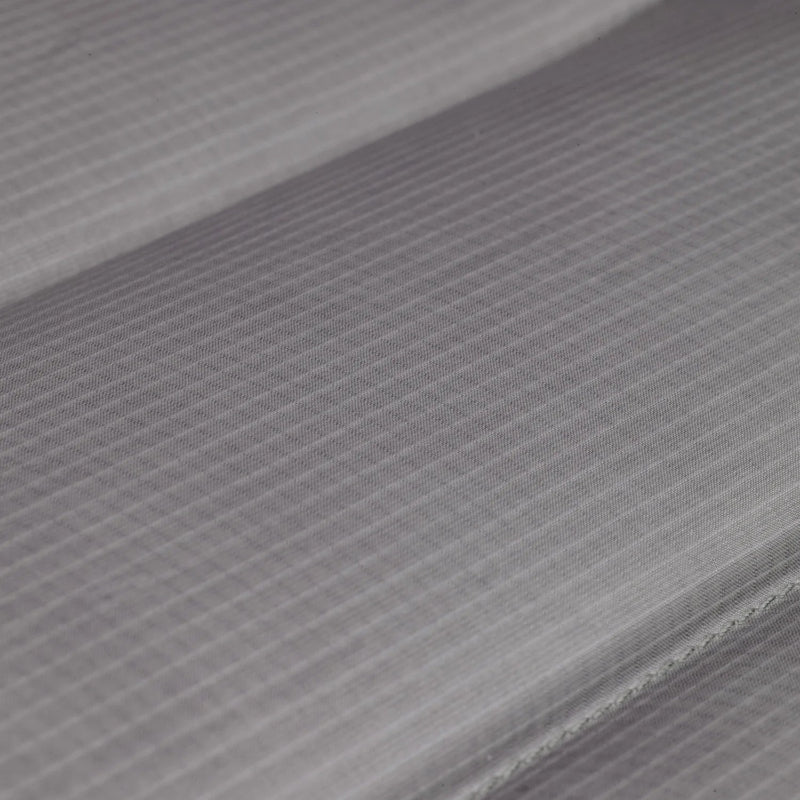 Close-up of gray fabric with a subtle pattern