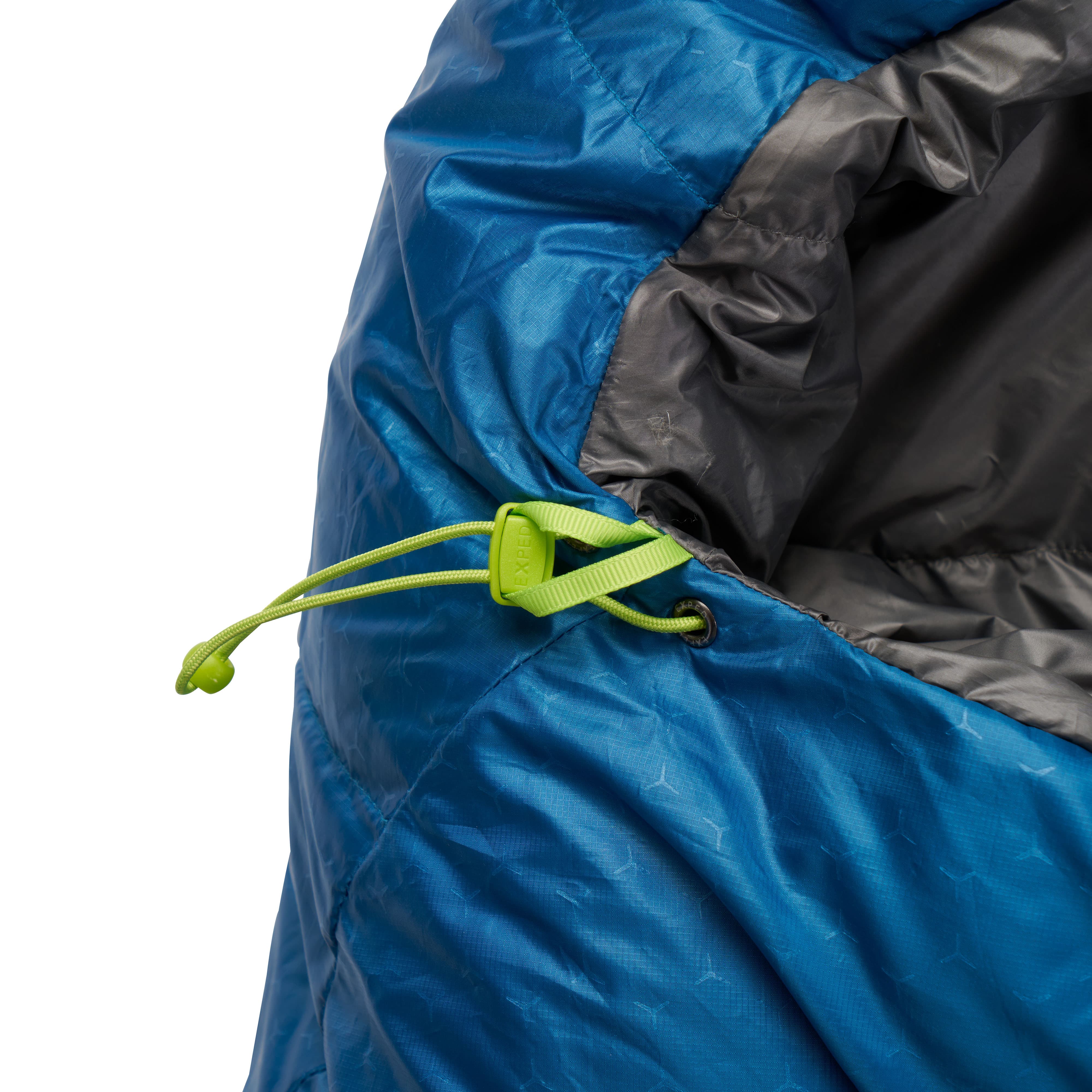 Close-up of a blue lightweight sleeping bag down with a green drawstring on a white background