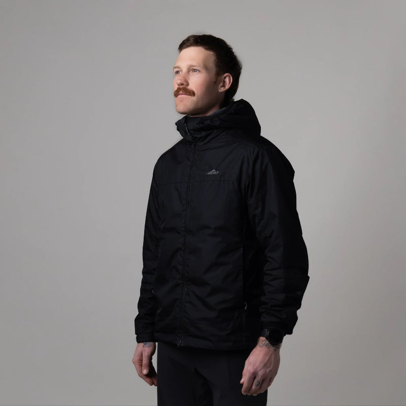 Man wearing a black jacket with a brand logo on a gray background