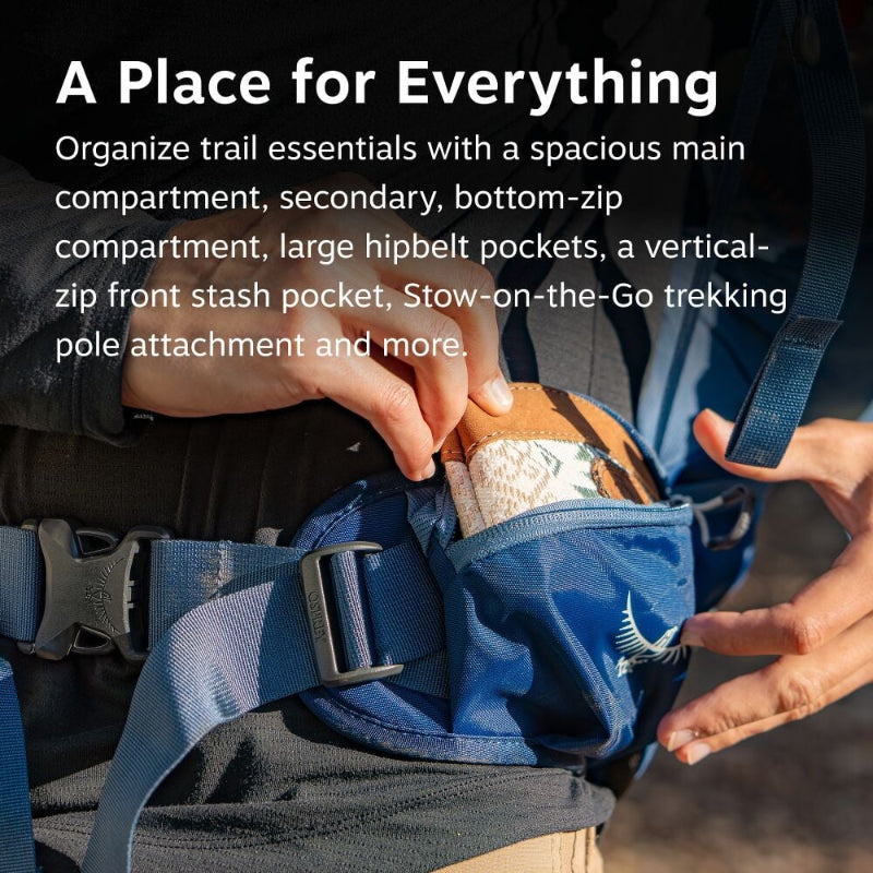 Person organizing trail essentials in a blue hiking backpack with text describing its features.
